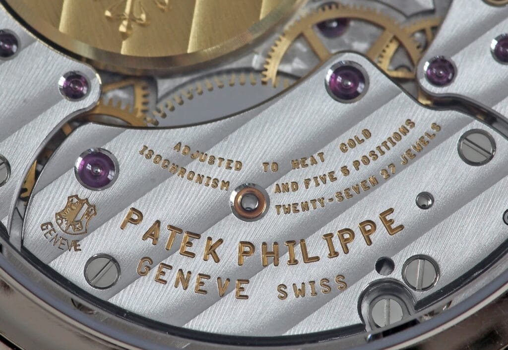 Patek Philippe movement with visible anglage and perlage. Highlight points of authenticity.